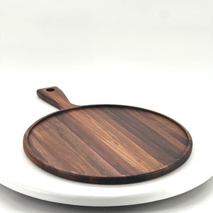 Raised edge charcuterie board in walnut hardwood built with edge grain construction for a more durable surface.