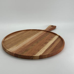 Raised edge charcuterie board in cherry hardwood built with edge grain construction for a more durable surface.