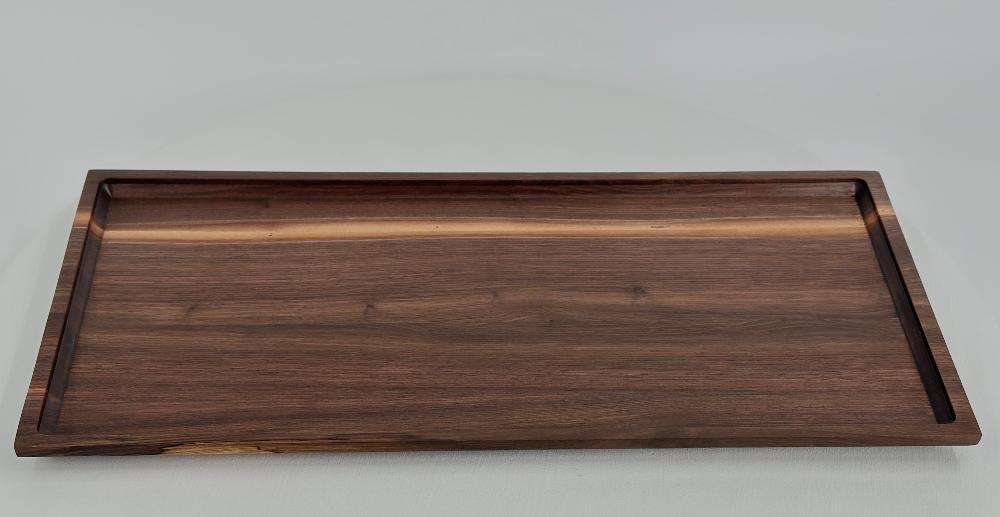 overhead image of walnut tray displaying framed edge and beautiful grain pattern.