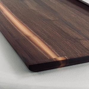 Close up image of walnut tray that provides view of wood angles and natural beauty.