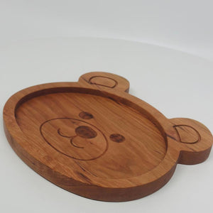 Solid cherry teddy bear plate with engraved face. 